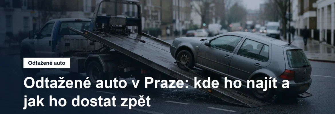 Odtahový vůz nakládá osobní auto v městské ulici