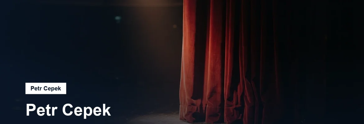 Divadelní jeviště s reflektorem a rudou oponou