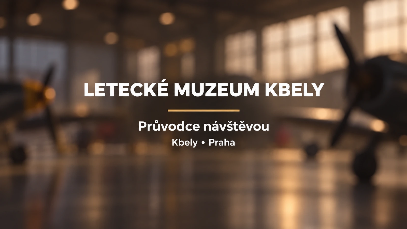 Letecké muzeum Kbely: bílý titulek se zlatou linkou na rozostřeném pozadí historického hangáru